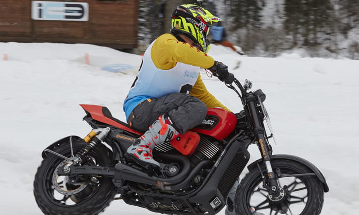 Racing a Harley Davidson 750 Street Rod on Ice and Snow at Ice Rosa Ring in Italy